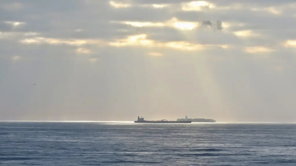 A crude oil tanker waiting at anchor outside a harbour